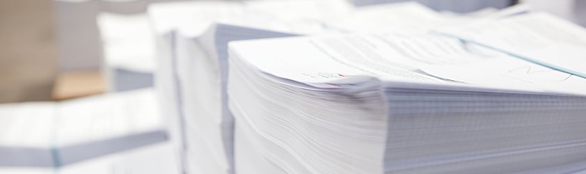A large stack of printed letters.